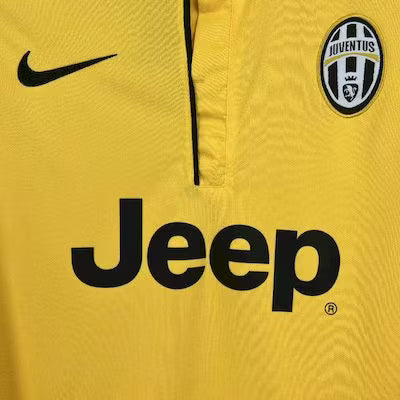 Yellow Juventus football jersey close-up: black Nike swoosh and Jeep sponsor text
