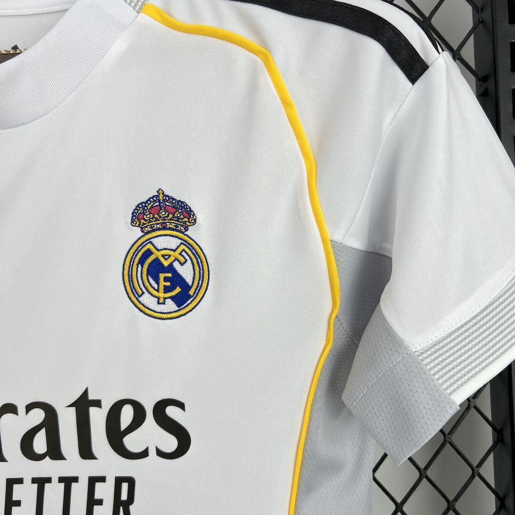 Women’s white football jersey chest with Real Madrid crest and yellow-trim piping