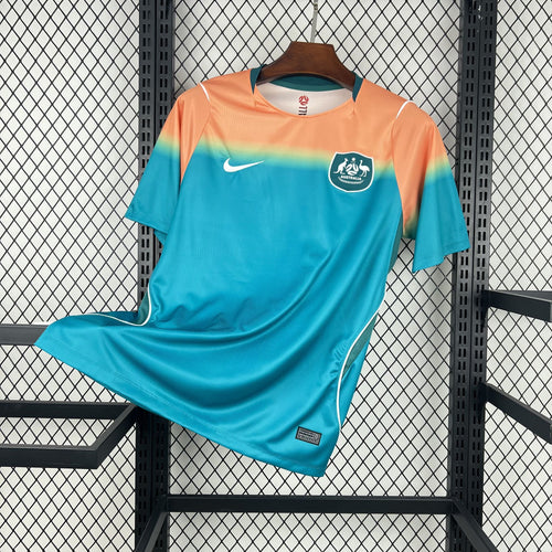 Fan soccer jersey with teal-to-orange gradient, Nike swoosh, and Australia crest on chest