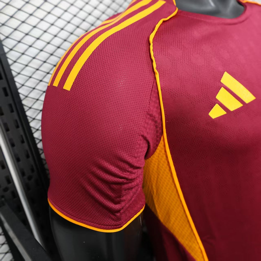 Maroon short-sleeve jersey sleeve with yellow adidas stripes and yellow side piping.