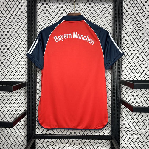Red Bayern Munich retro jersey back with navy collar and “Bayern Munchen” lettering