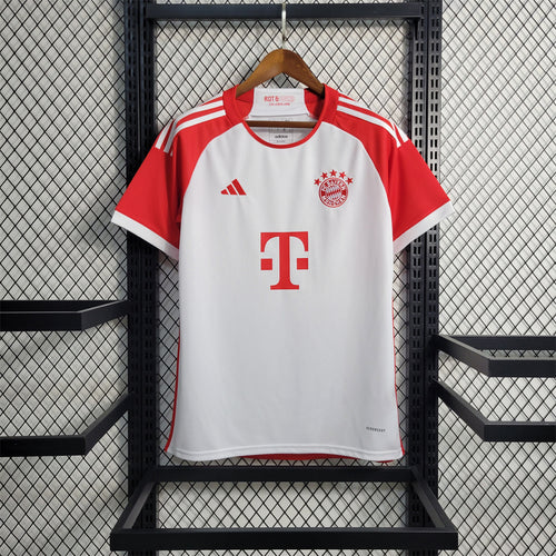Bayern Munich red and white home fan jersey on hanger with crest and sponsor logo