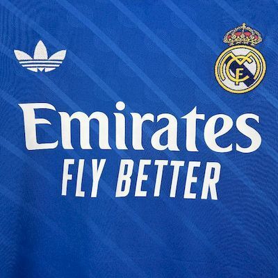 Blue Real Madrid jersey chest with white Emirates Fly Better sponsor and adidas trefoil