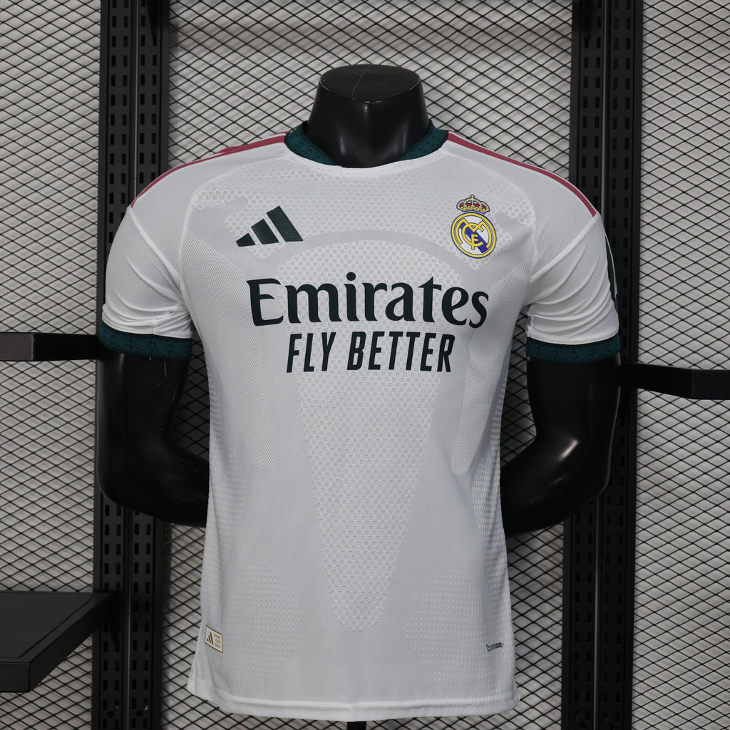White Real Madrid home football jersey with teal trim, Emirates sponsor, and club crest