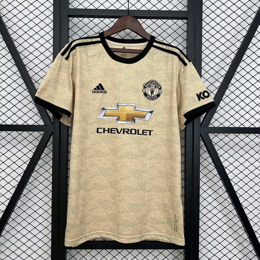 Retro football jersey, gold with black trim, front sponsor logo and Man Utd crest
