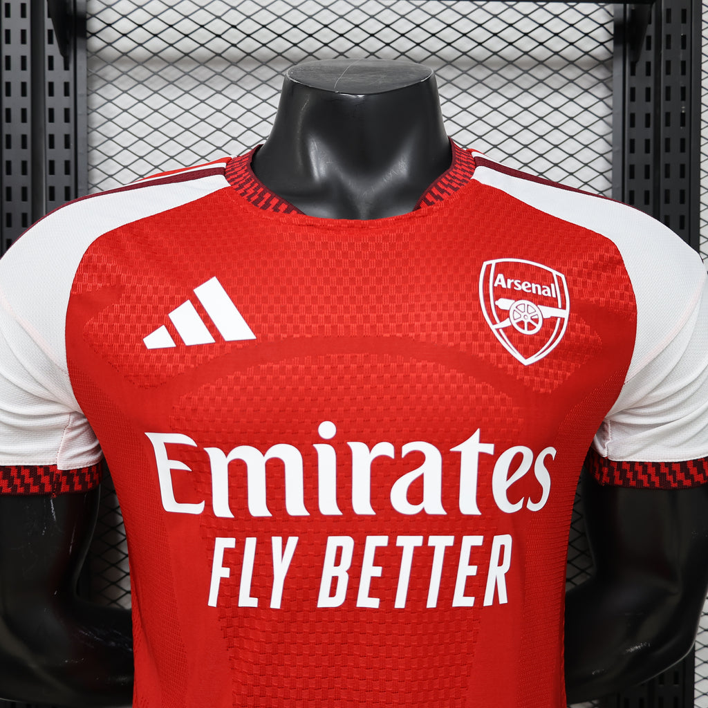 Arsenal home football jersey front close-up, Emirates Fly Better text and Arsenal crest