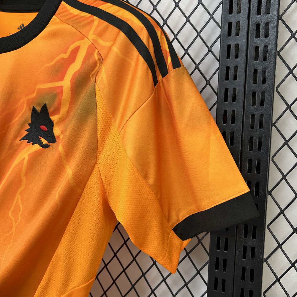 Orange soccer jersey sleeve and side panel with black trim stripes