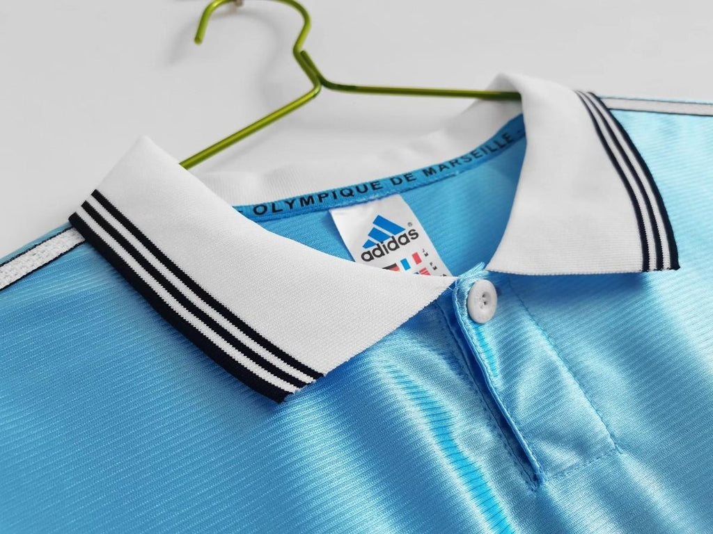 Sky blue soccer jersey collar with button placket and striped adidas neck trim