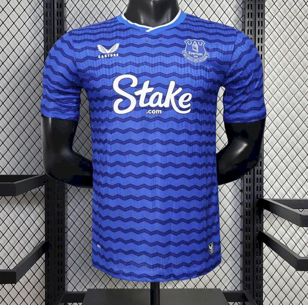 Blue Everton home player soccer jersey with striped pattern, Stake.com sponsor, crew neck
