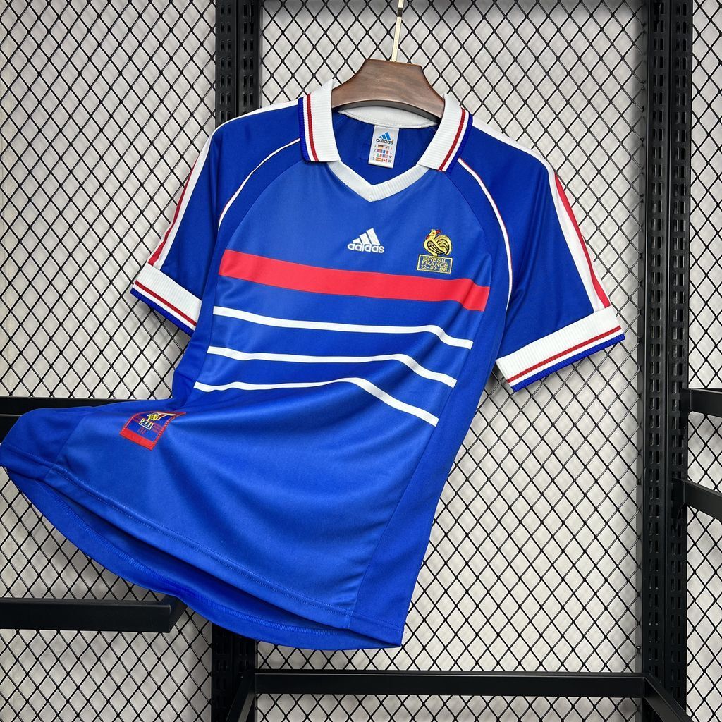 Blue retro France football jersey with Adidas logo and crest, white/red sleeve trim.