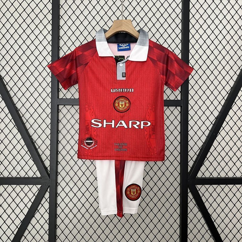 Kids Manchester United home soccer kit: red jersey with button collar and SHARP sponsor