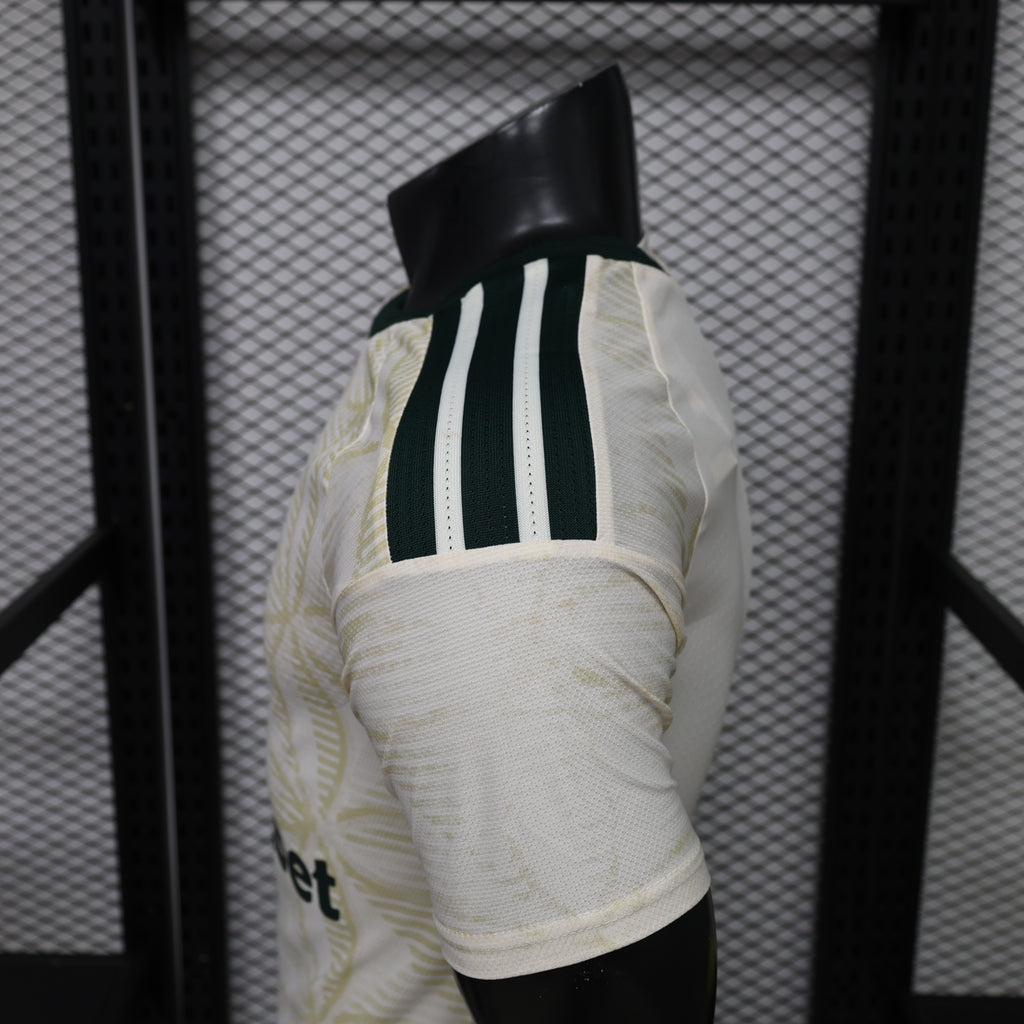 Light yellow football jersey back panel with black vertical adidas stripes