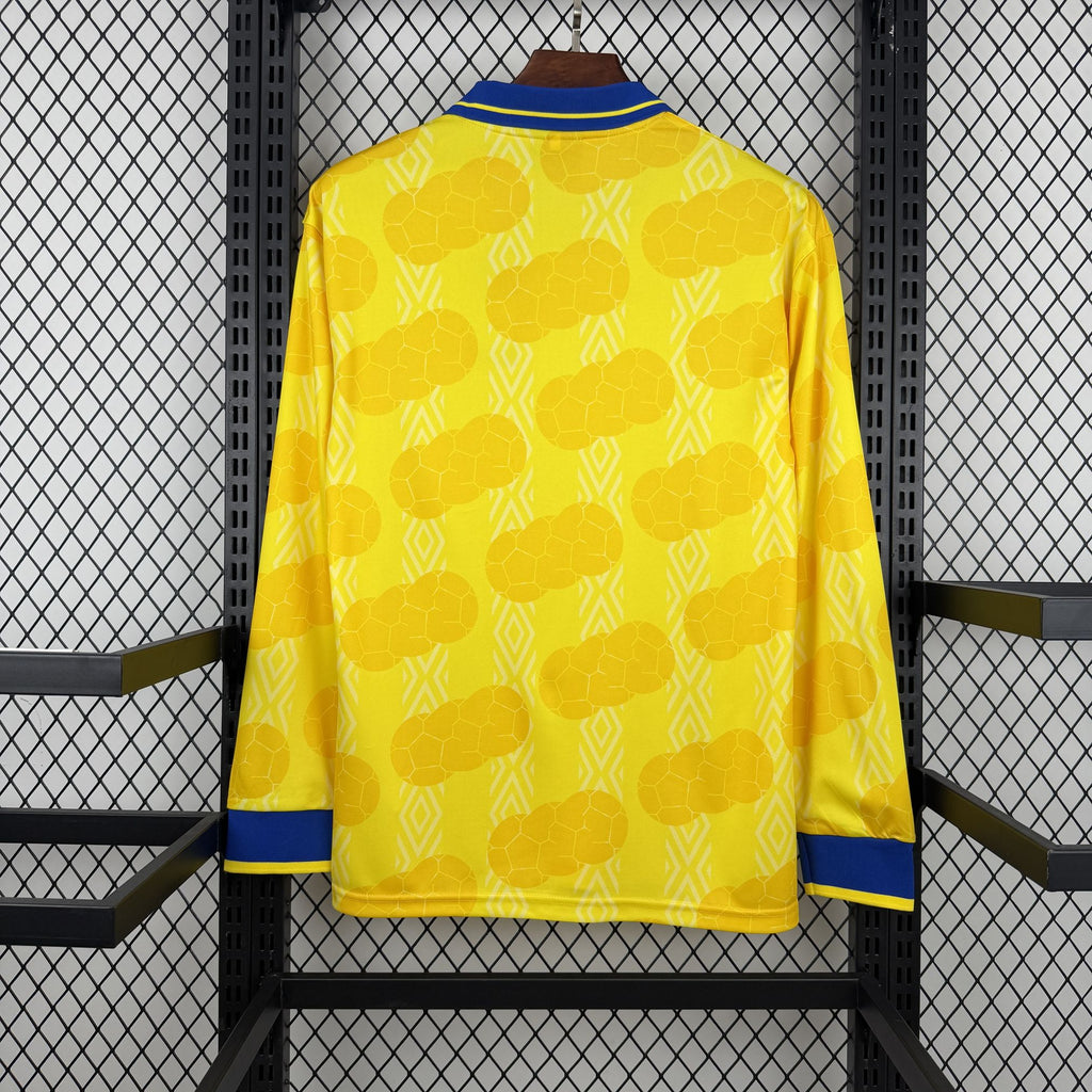 Retro Colombia home soccer jersey back, yellow with blue cuffs and collar trim.