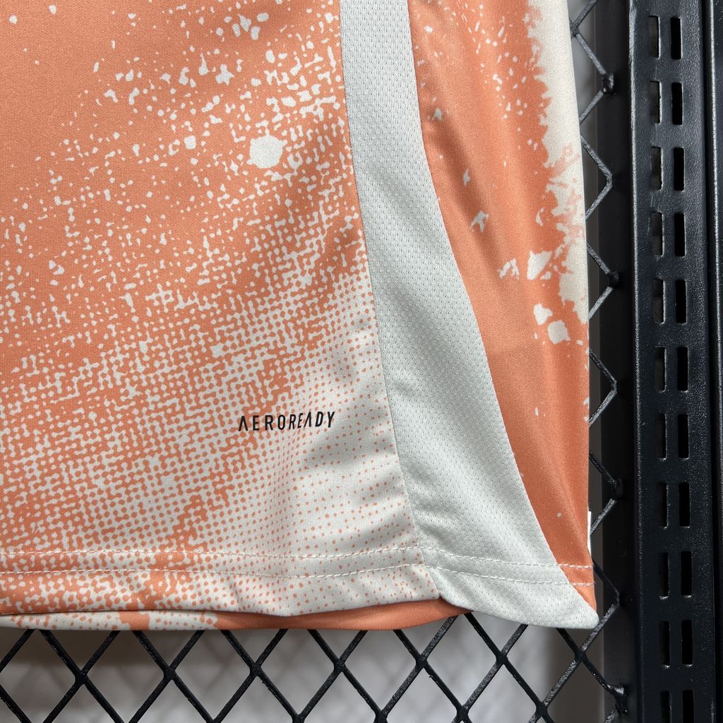 White and orange jersey fabric close-up with AEROREADY logo