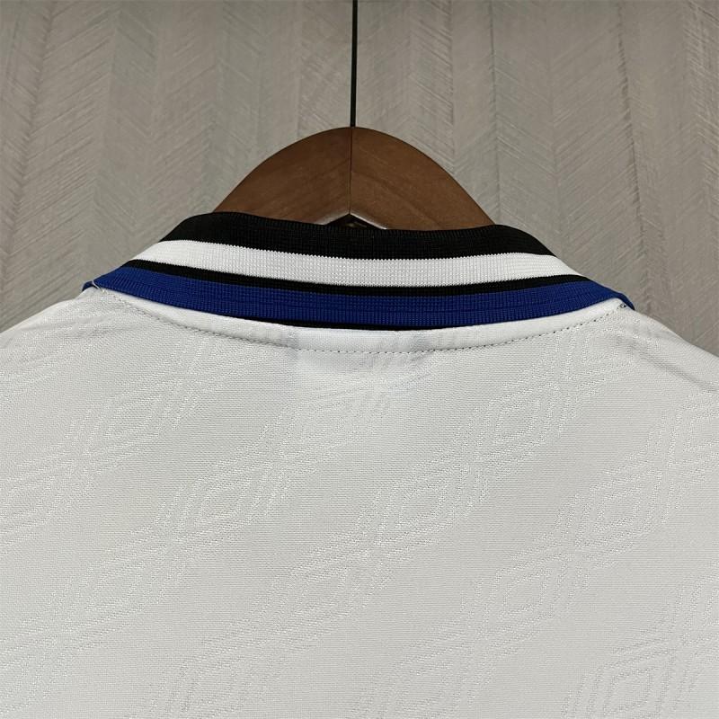 Retro away jersey back collar, black neckline with white stripe and blue horizontal trim