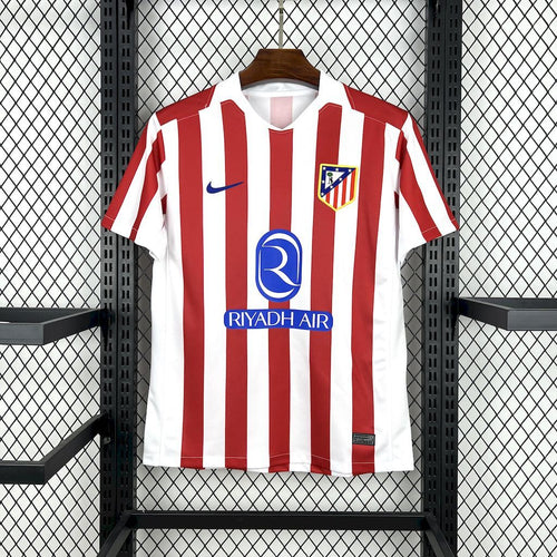 Atletico Madrid home soccer jersey, red and white vertical stripes, front logo and RIYADH AIR