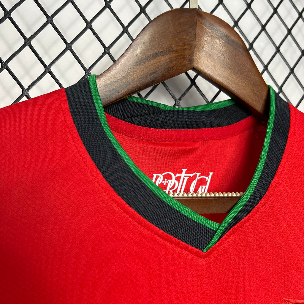 Red Portugal home football jersey neckline with green V-trim and crest detail