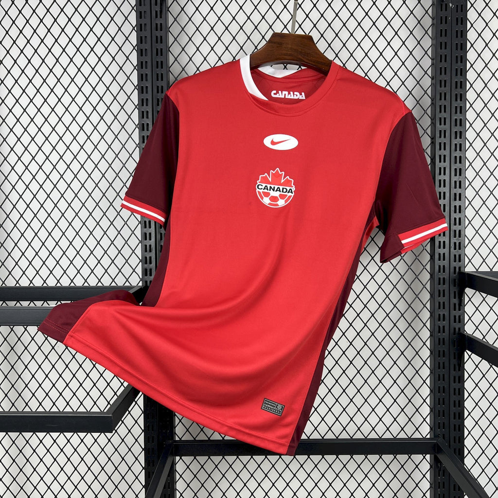 Red Canada soccer jersey with white collar trim and Nike logo on chest.