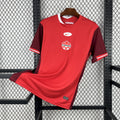 Red Canada soccer jersey with white collar trim and Nike logo on chest.