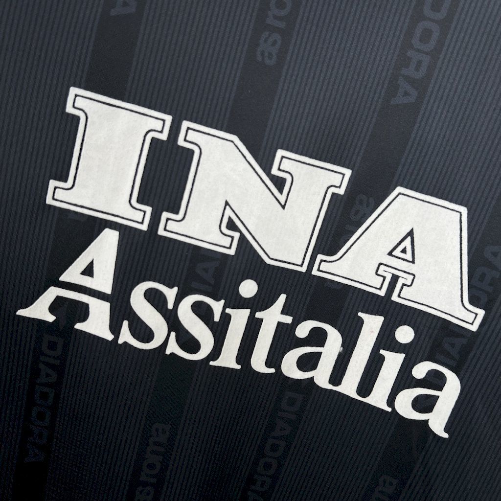 Retro football jersey front graphic, white INA and Assitalia text on dark navy