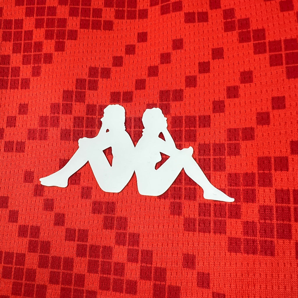 Red jersey front with white player silhouette graphic