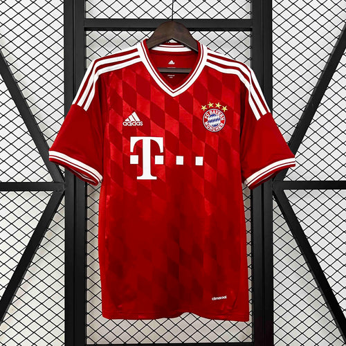 Red retro home soccer jersey with white V-neck trim, Bayern crest, and sponsor print