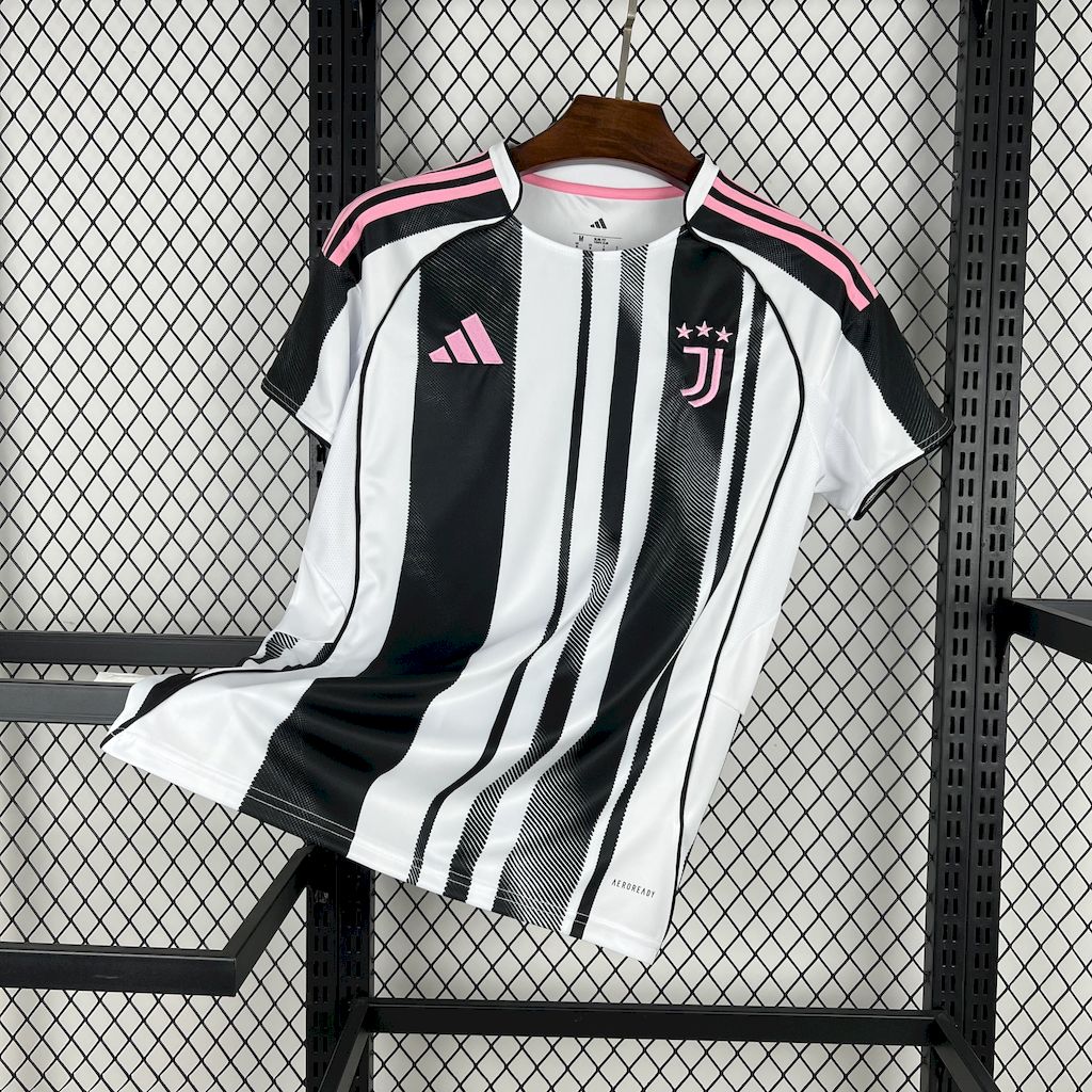 White and black striped home football jersey with pink trim and crest detail