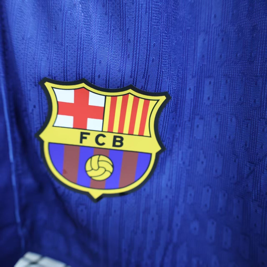 Blue player shorts with FC Barcelona crest logo on front