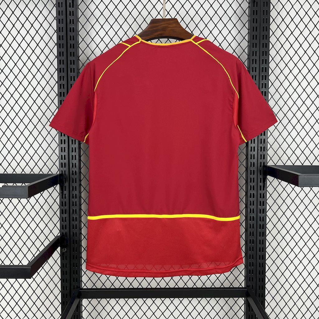 Retro Portugal home football shirt, back view in red with green accents and gold trim