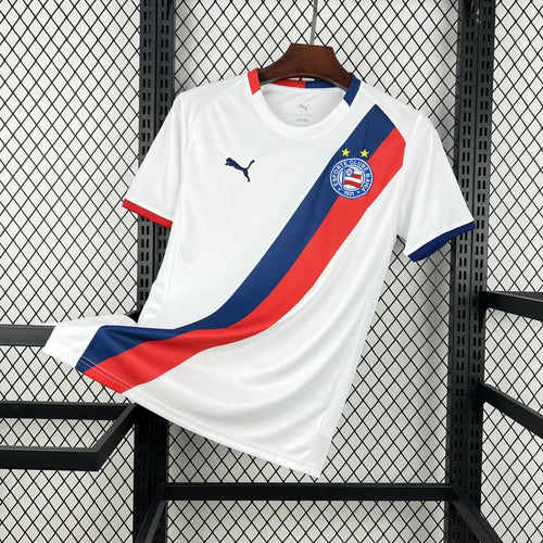 White soccer jersey with diagonal blue and red stripe, team crest, and Puma logo.