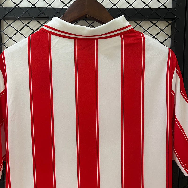 Red-and-white vertical striped soccer jersey, crew collar with neck button placket