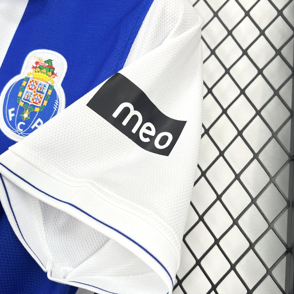 Blue sleeve and white trim of retro jersey with FC Porto crest and meo logo