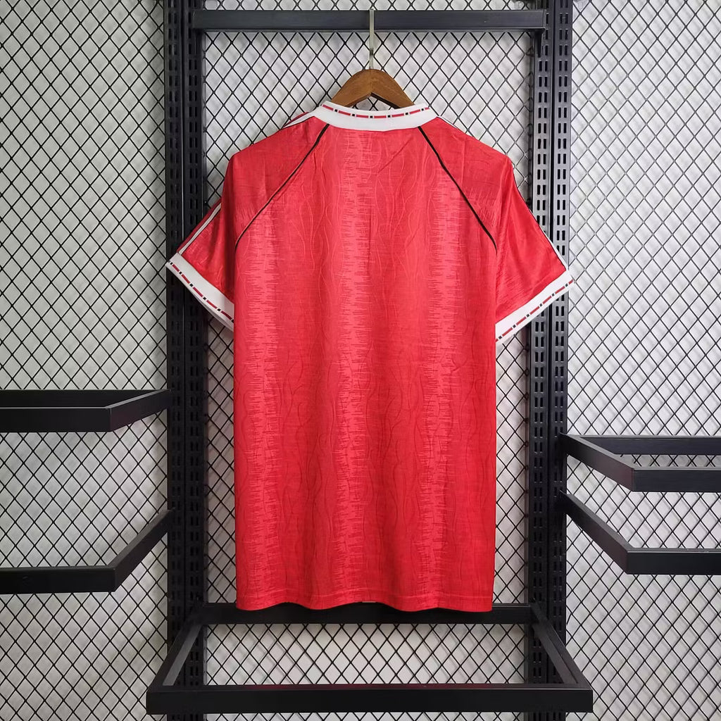 Red retro home football jersey with white sleeve trim and raglan sleeves