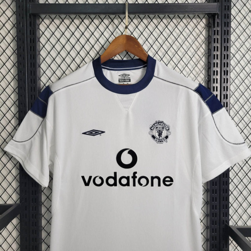 White retro soccer jersey with blue collar, Vodafone sponsor, and club crest on chest