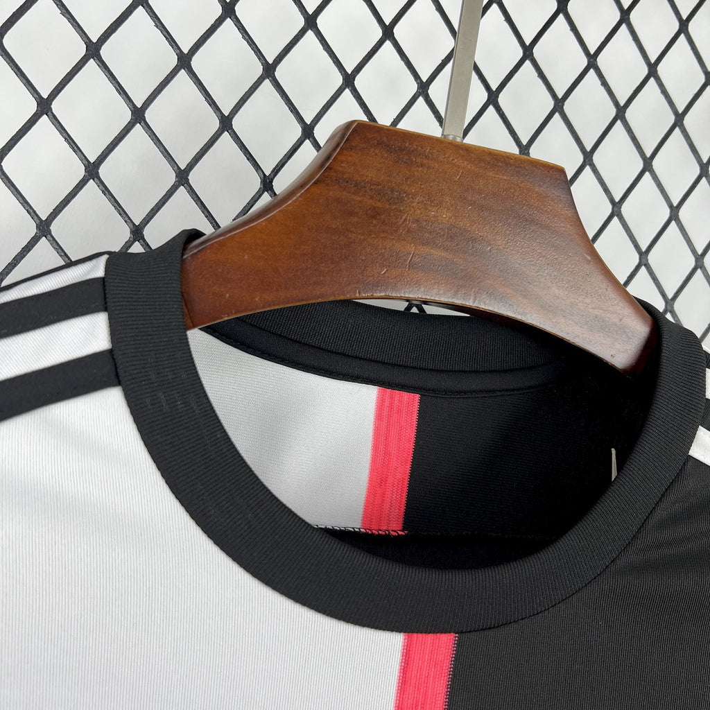 Retro soccer jersey neckline with red center stripe and black ribbed collar