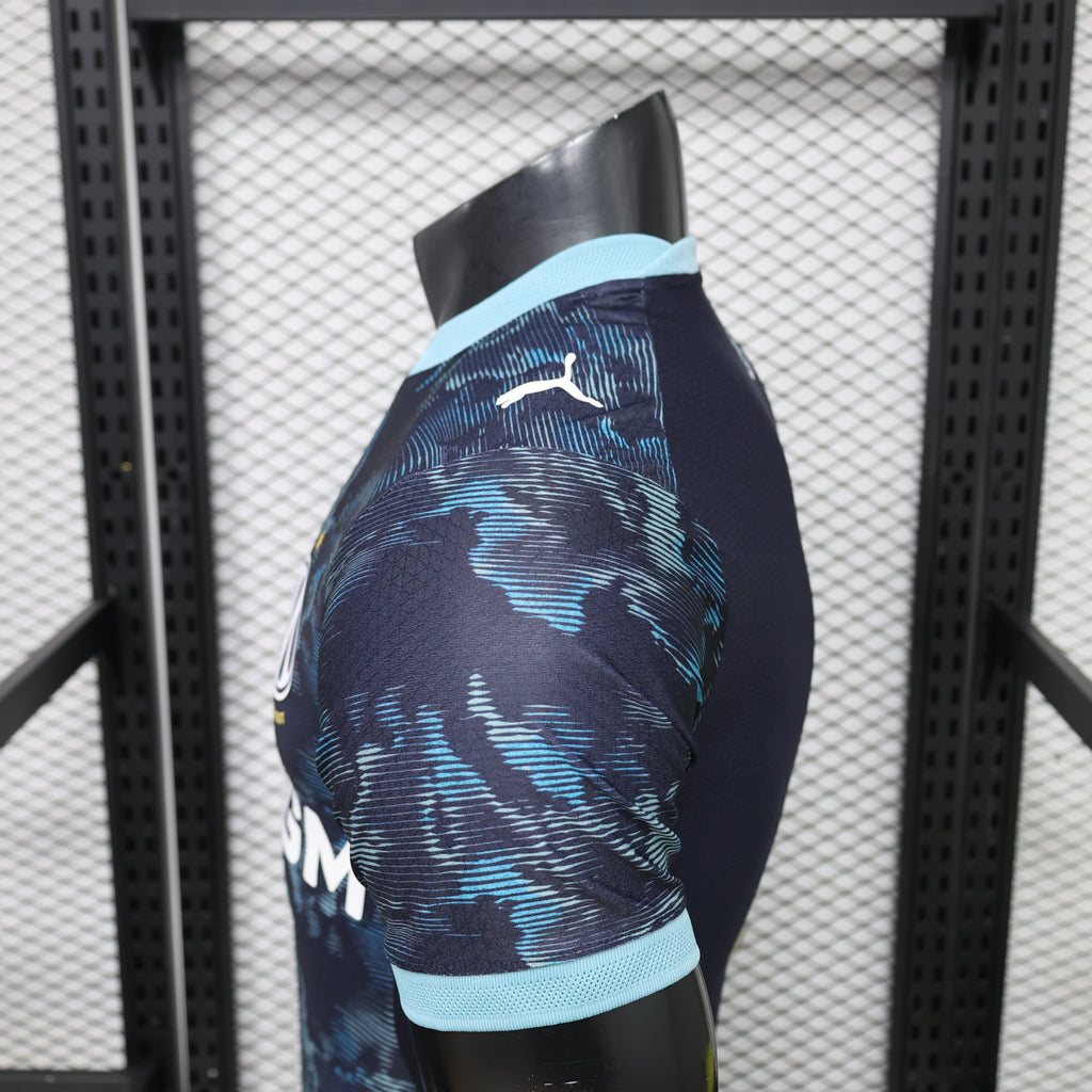 Side view of navy patterned football jersey with light-blue sleeve trim