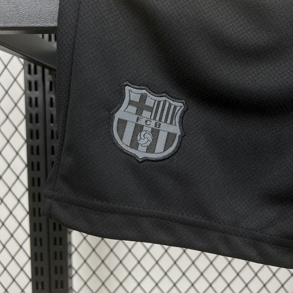 Black kid shorts with stitched FC Barcelona crest emblem