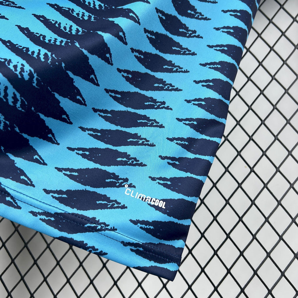 Blue jersey sleeve with repeating wave pattern and small "CLIMACOOL" text