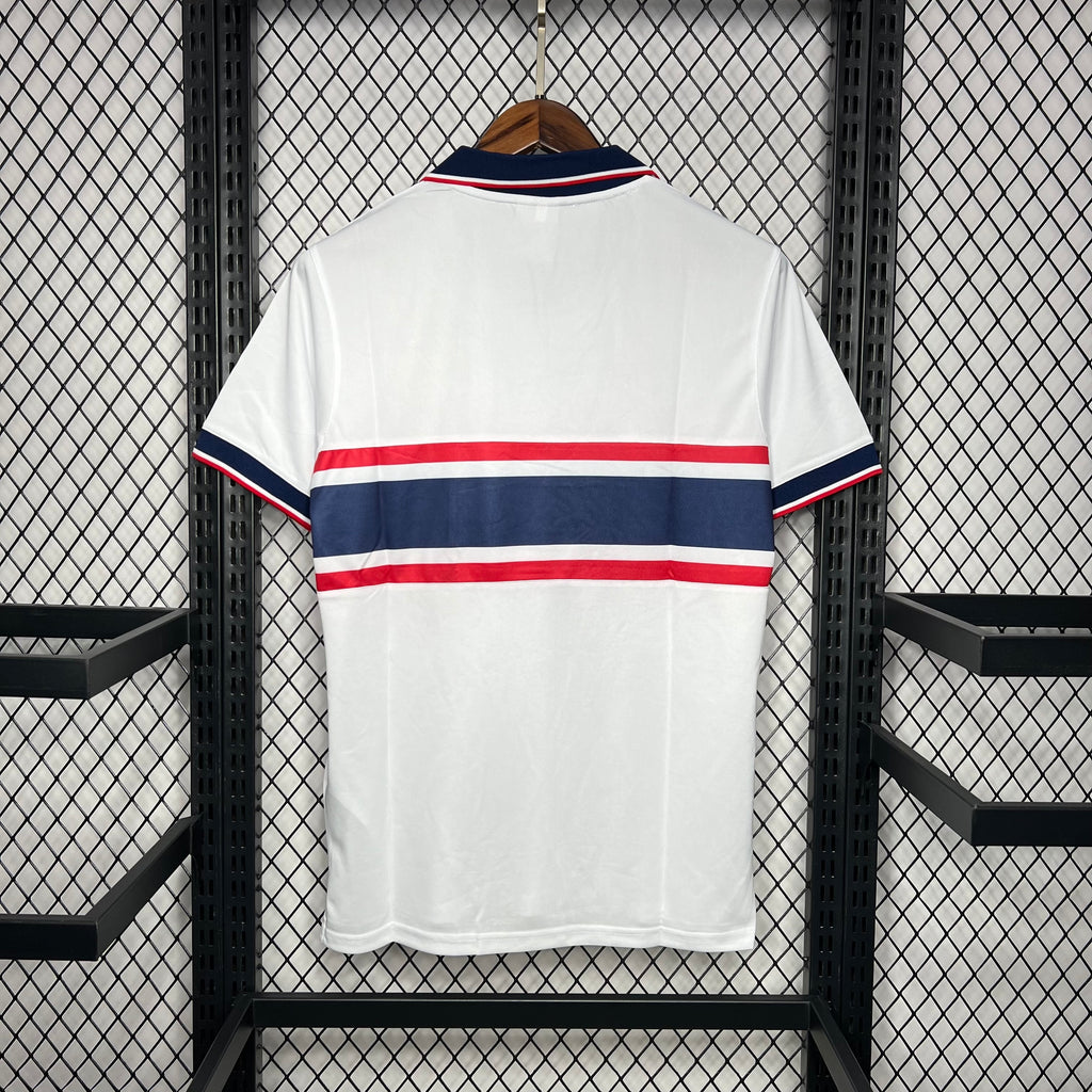 Back view white USA retro soccer jersey with navy/red striped yoke and trim