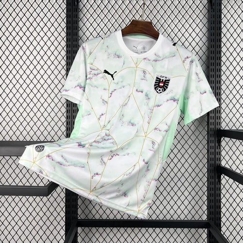 Austria away soccer jersey in white with mint-pink watercolor print and chest Puma logo