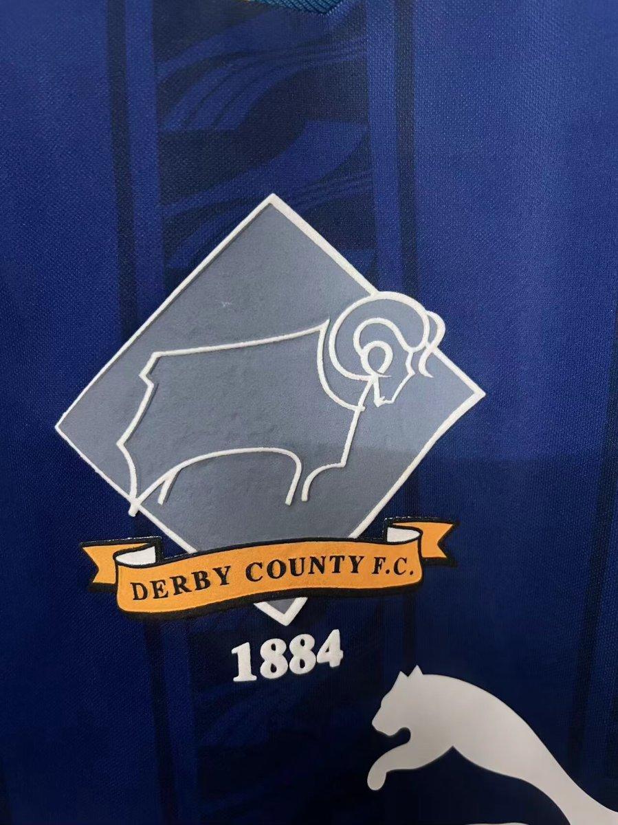 Blue jersey chest crest with Derby County F.C. 1884 and Puma logo