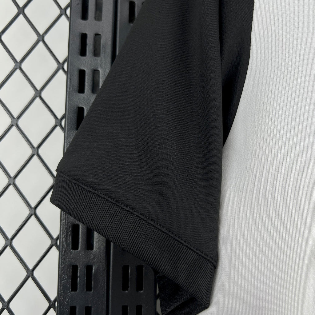 Short sleeve cuff with black ribbed trim on retro soccer jersey