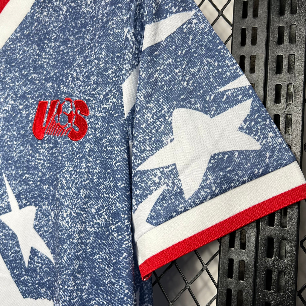 Side view USA 1994 away jersey with blue speckle texture, white stars and red trim