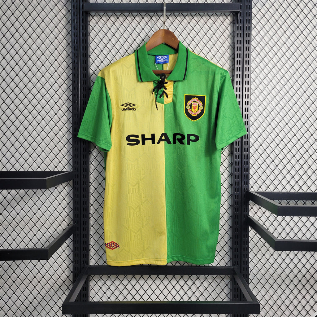 Green and yellow split retro football jersey with SHARP sponsor and club crest