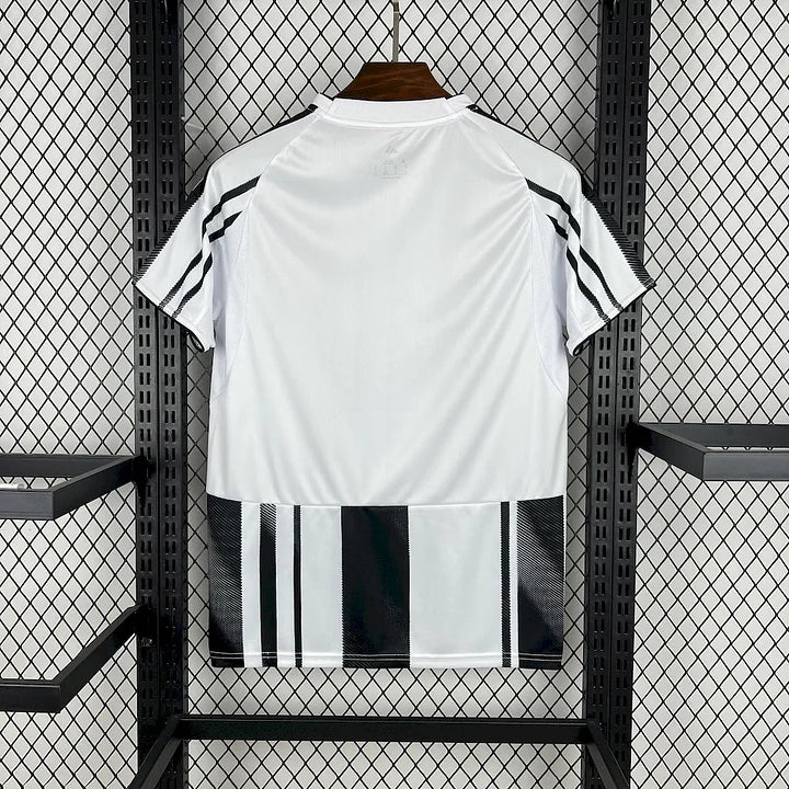 White home football jersey with black vertical stripes at hem and team crest