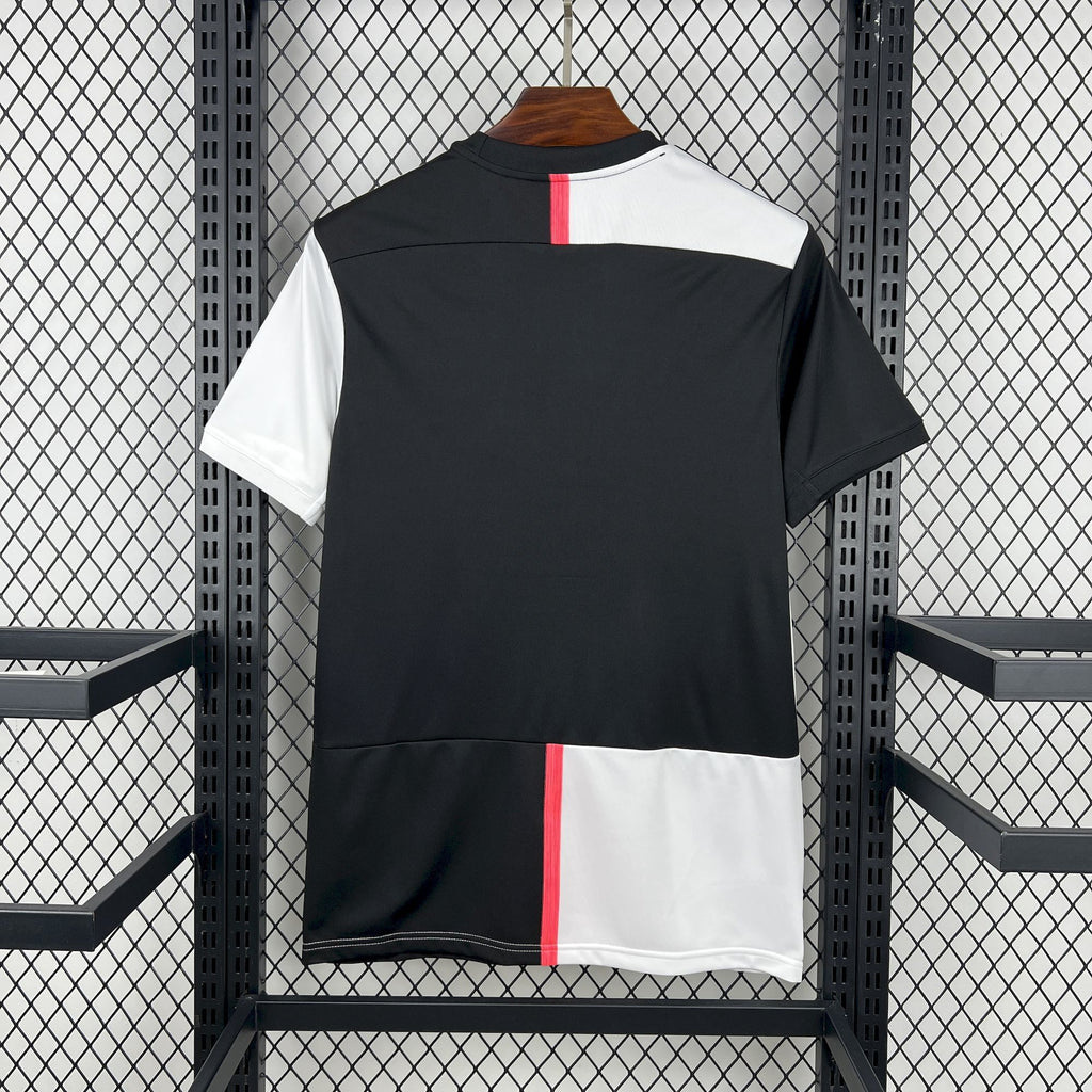 Retro soccer jersey, black and white panels with red vertical stripe, short sleeves