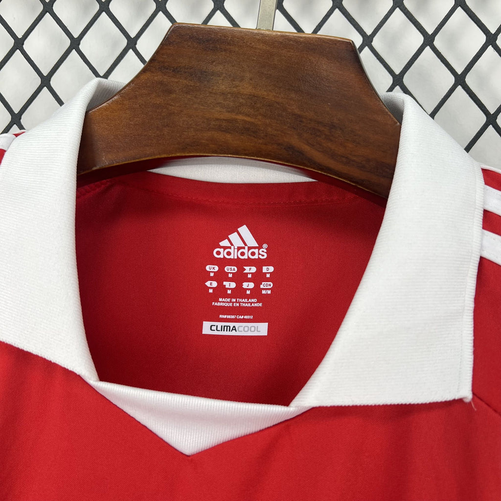Red soccer jersey neckline with white collar trim and adidas inner label
