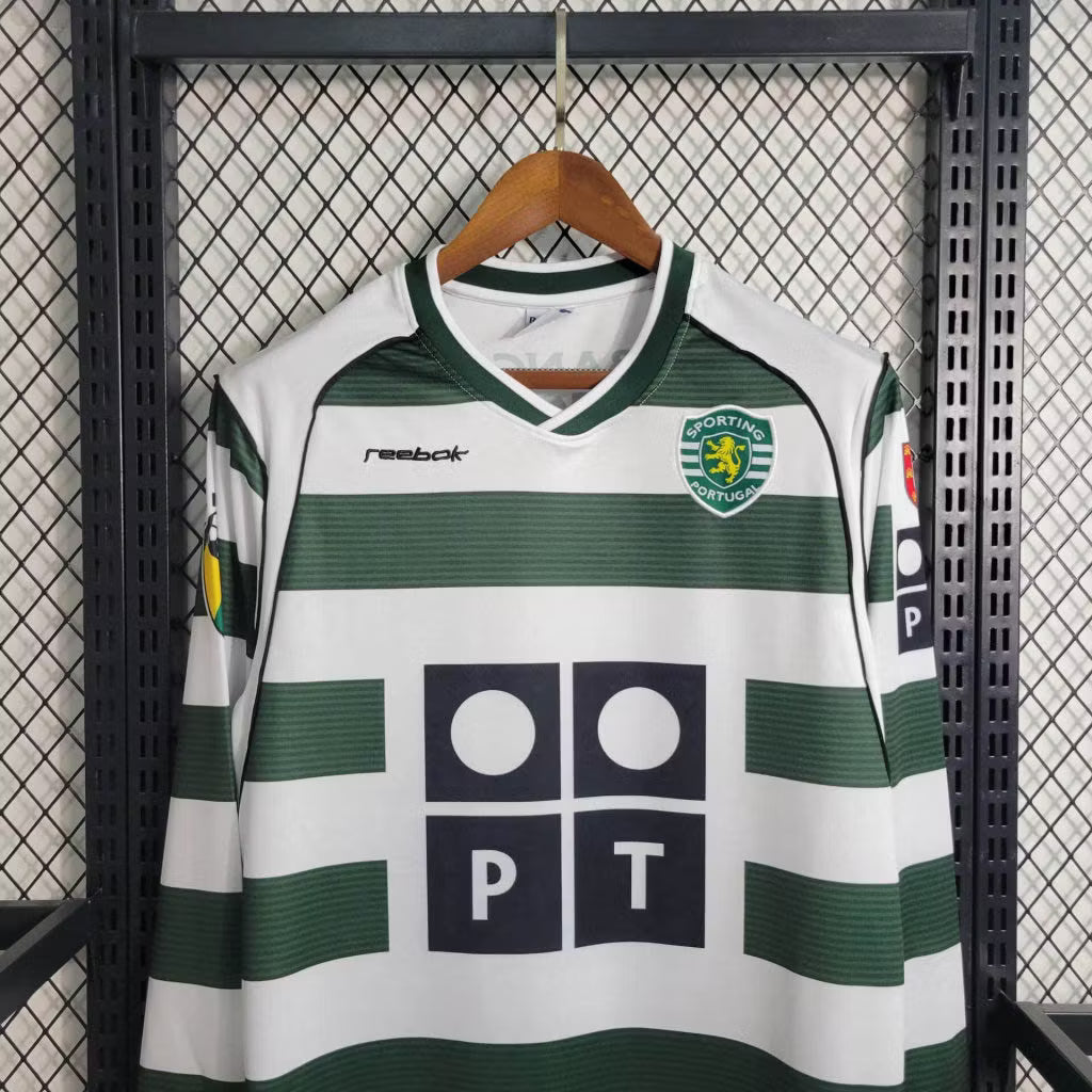 Sporting CP home jersey front, white base with green stripes, Reebok logo and crest