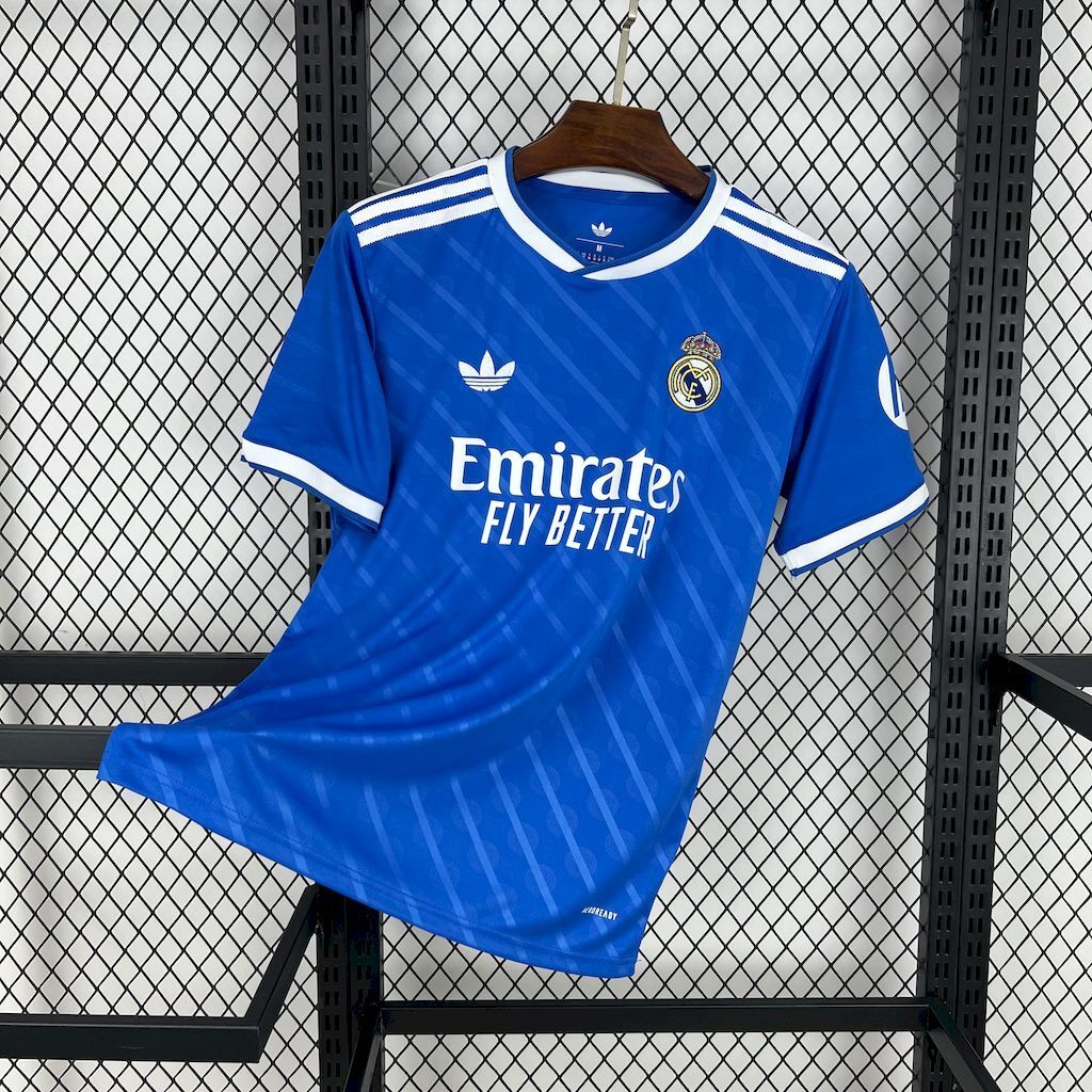Real Madrid 2025/26 third football jersey, blue with white trim and Emirates sponsor