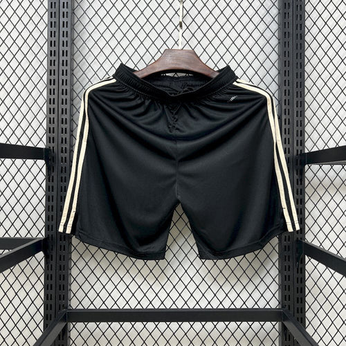 Black football fan shorts with white twin stripes down the sides and straight hem